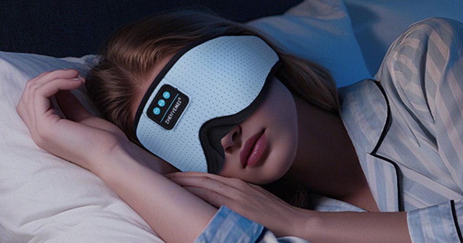woman wearing eye mask with headphones