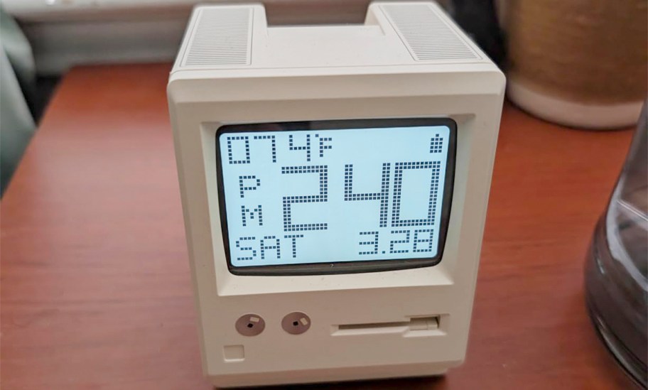 white computer alarm clock 