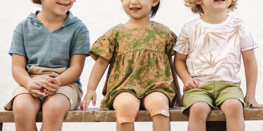 kids wearing tees shorts, and dresses 