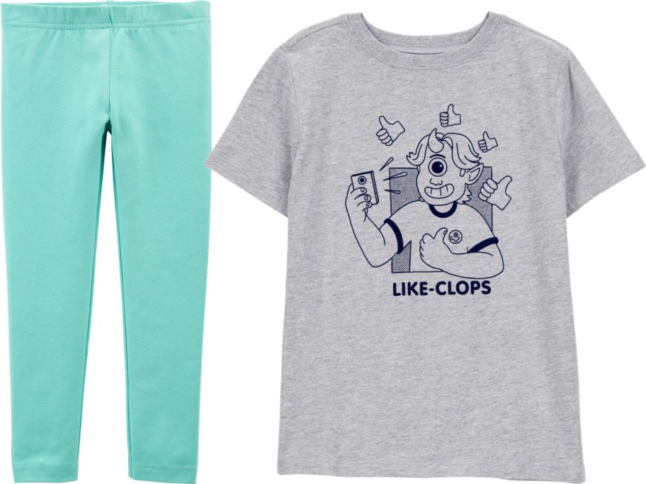 Gray T-shirt featuring a cartoon cyclops taking a selfie, surrounded by thumbs-up icons, with "LIKE-CLOPS" text. Paired with teal leggings.