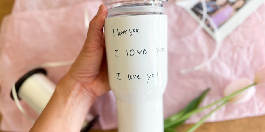 hand holding personalized tumbler