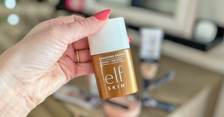 hand holding bottle of e.l.f. SKIN Bronzing Drops