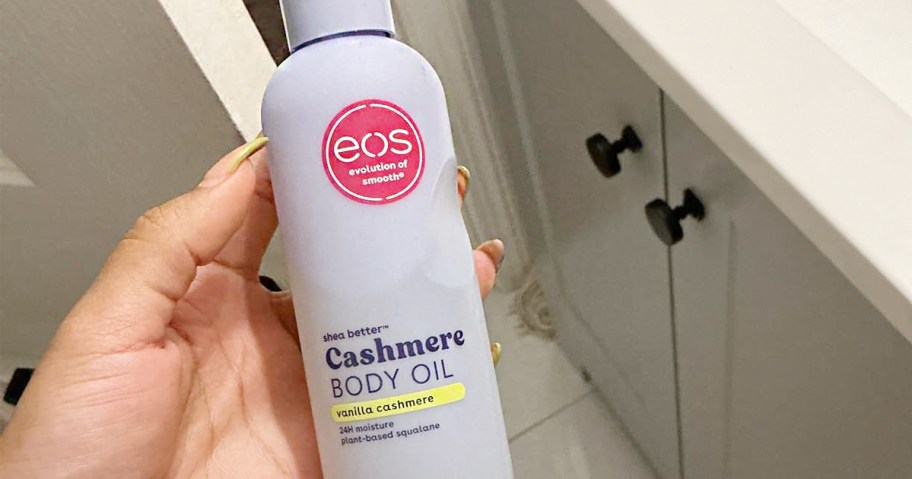 hand holding eos oil bottle 