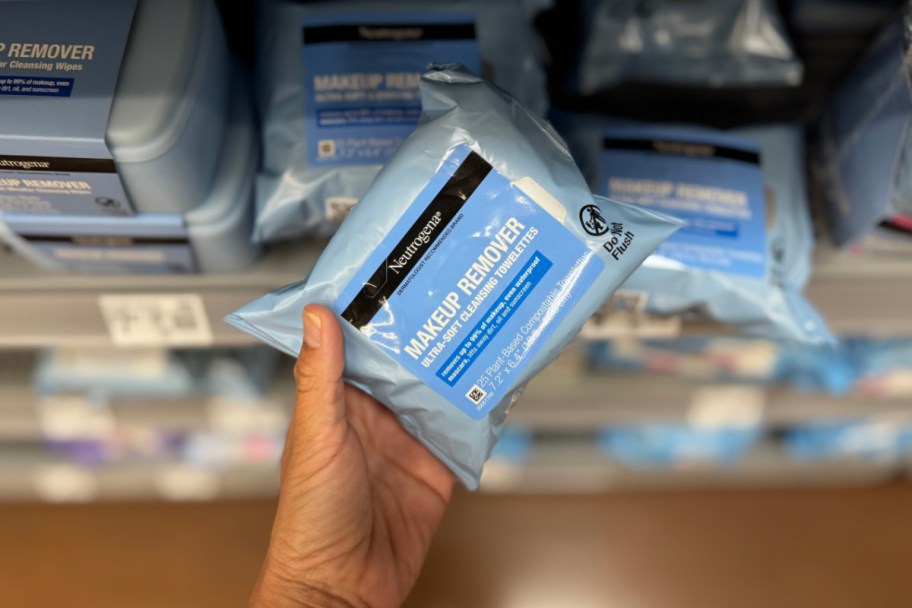 hand grabbing makeup wipes off shelf