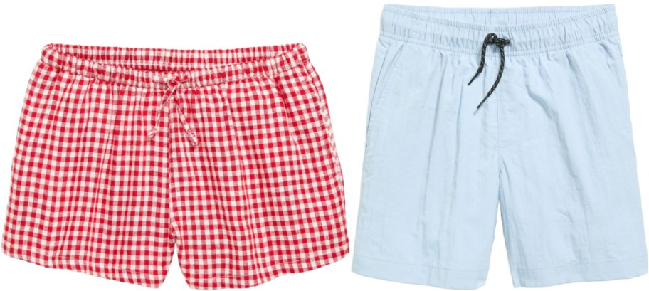 Two pairs of Old Navy shorts are displayed side by side. The left pair is red and white checkered, while the right is light blue. Both have drawstrings.