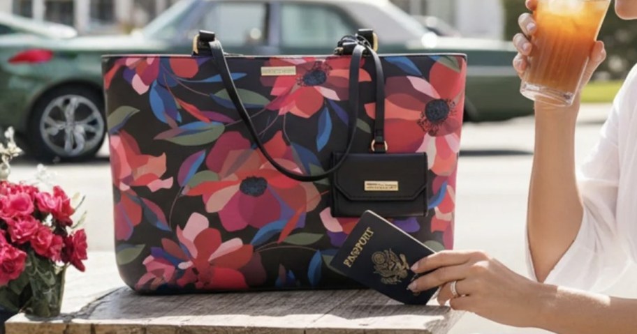 woman sitting at an outdoor table with a floral purse on the table