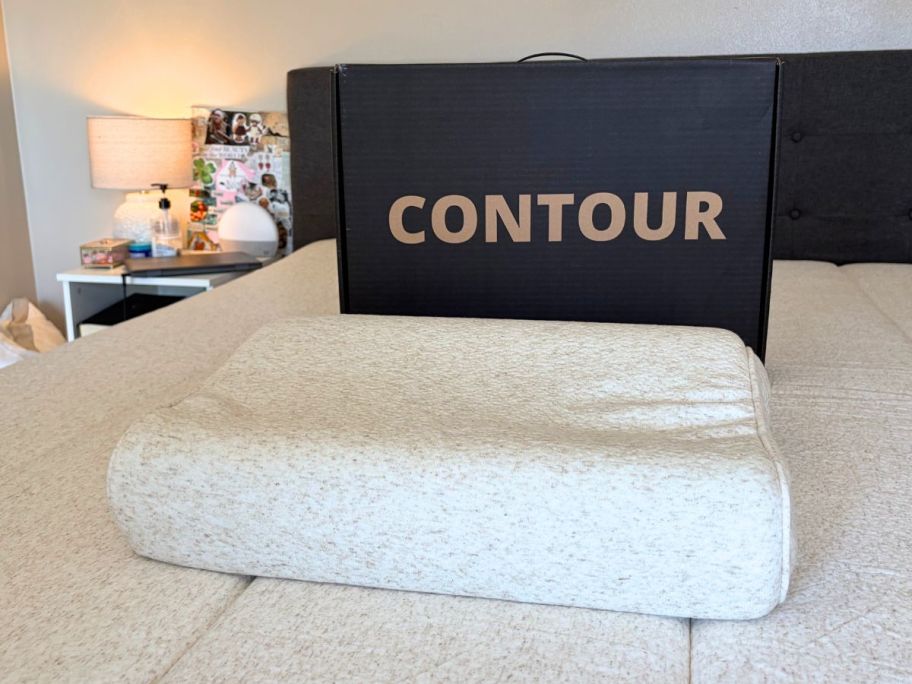 Keetsa Tea Leaf Contour Pillow on bed