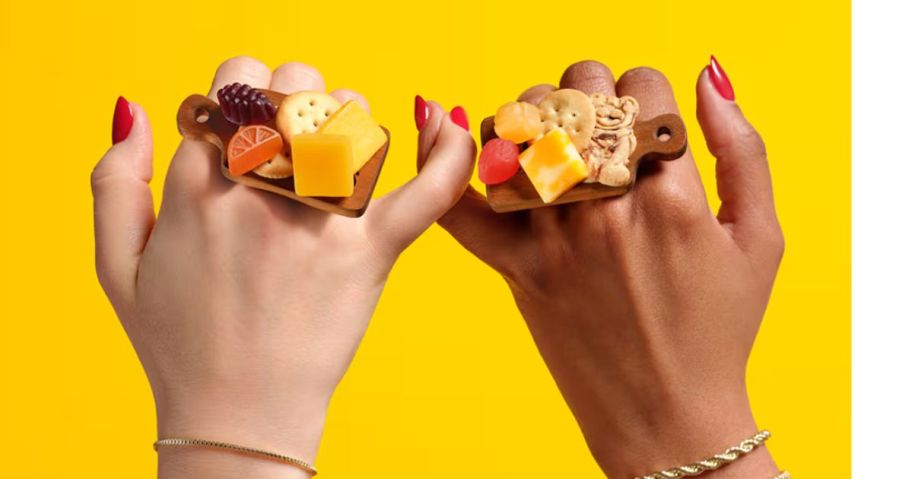 two hands wearing Lunchables CharcuteRings