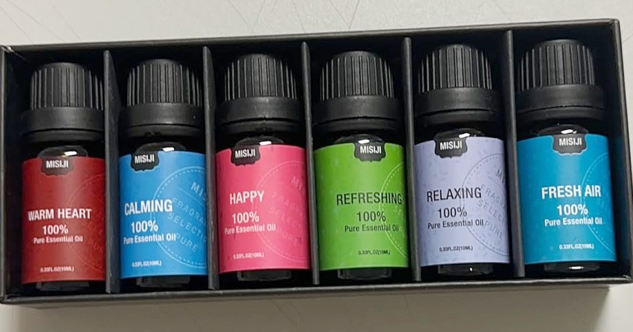 6-pack of essential oils in a black box on a table