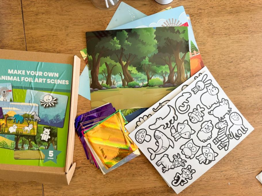 Make Your Own Foil Animal Art Scenes on table
