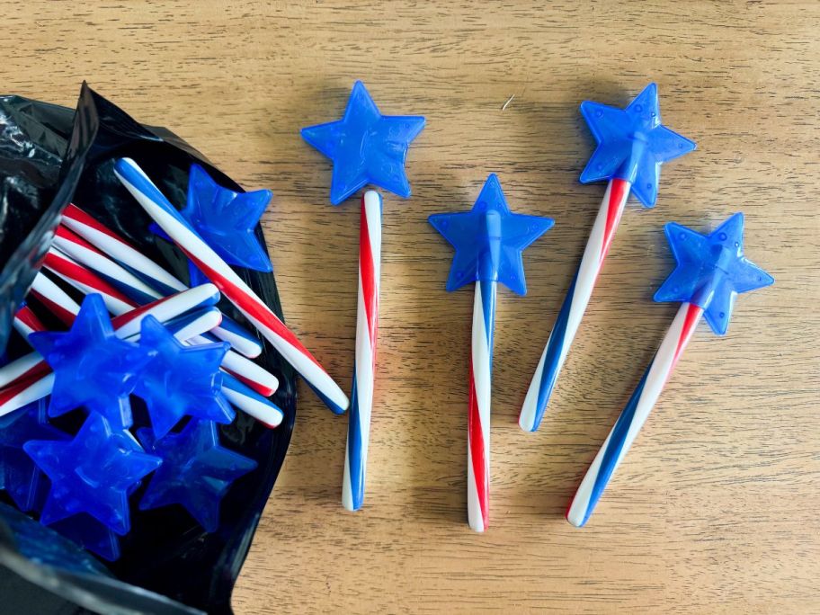 Patriotic Glow Swizzle Plastic Star Wands on table