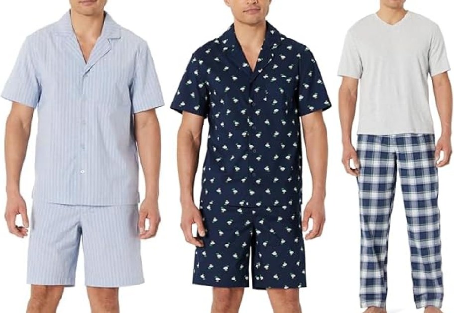 Three men are wearing different pajama sets. The first has light blue stripes, the second a navy set with a pattern, and the third a gray shirt with plaid pants.
