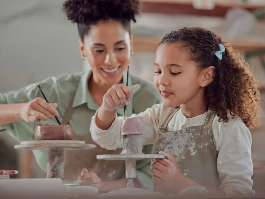 a mom and child taking a Pottery Class