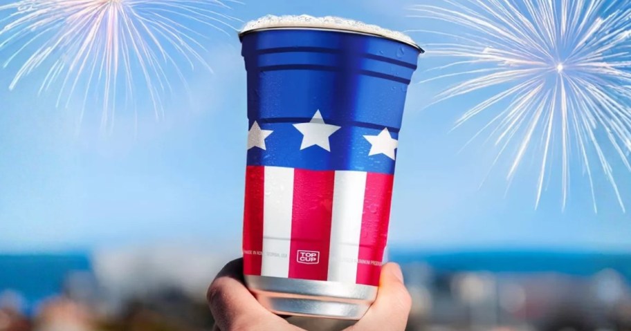 hand holding a red, white, and blue aluminum cup